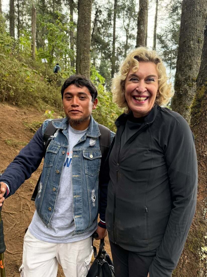 Cynthia Thyfault with Daniel, her guide, on the mountain trail